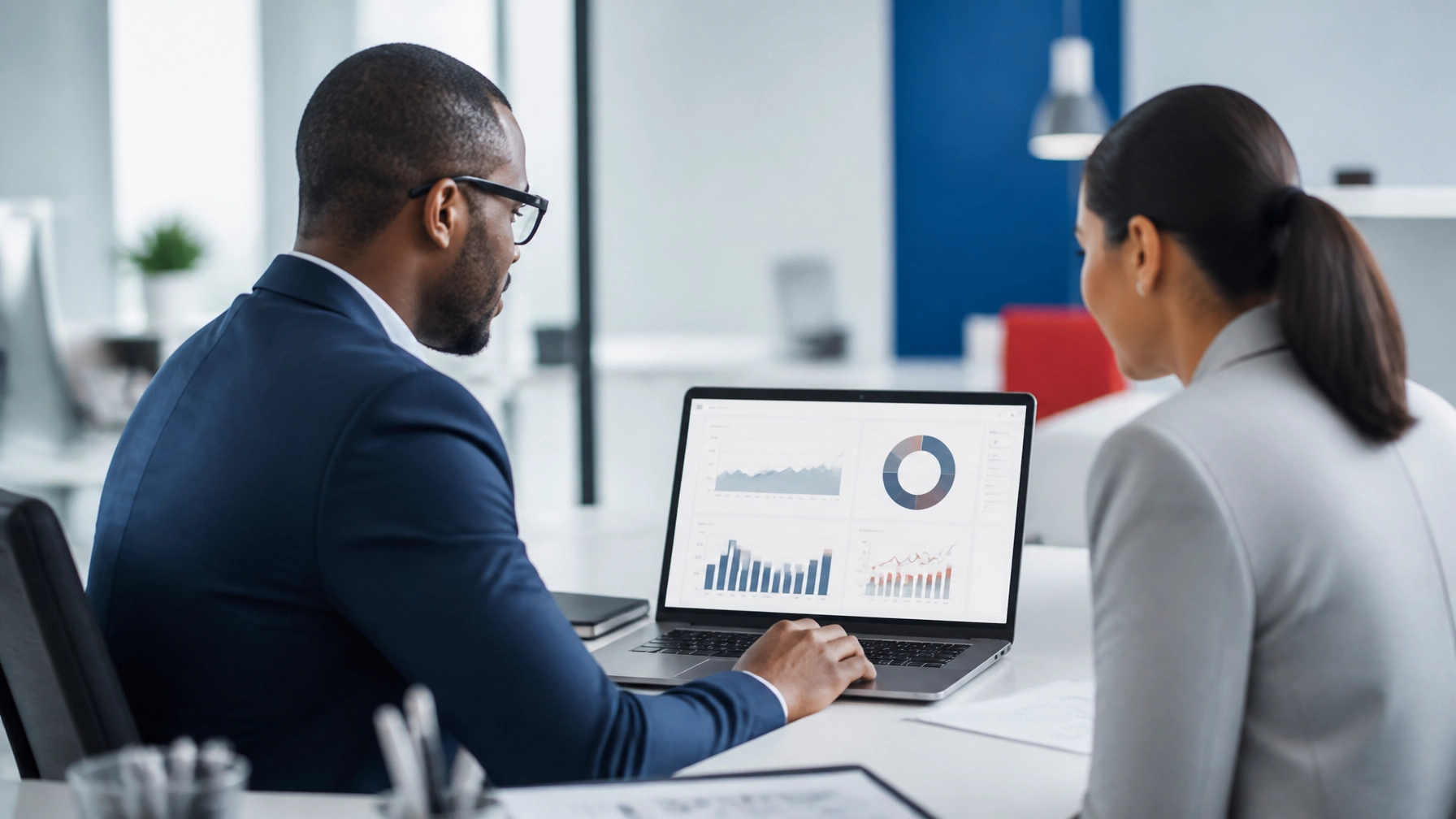 Business manager reviewing live answering service call metrics on a laptop